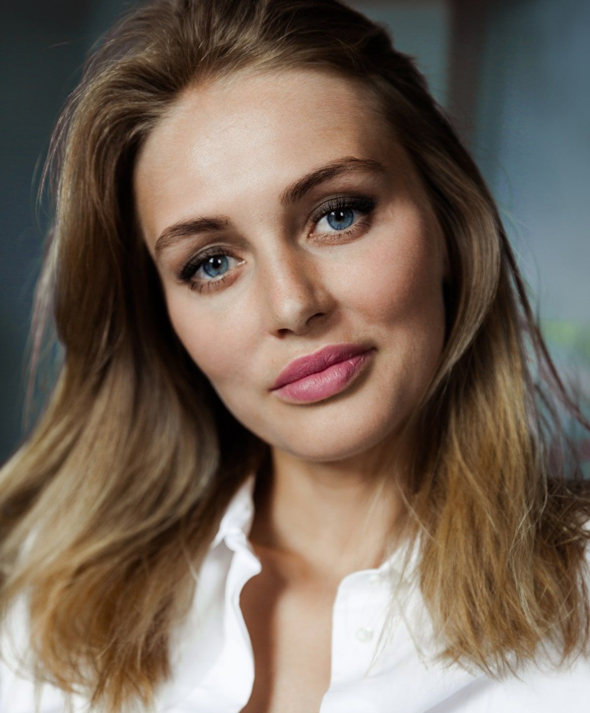 Close-up portrait of a woman with soft features.
