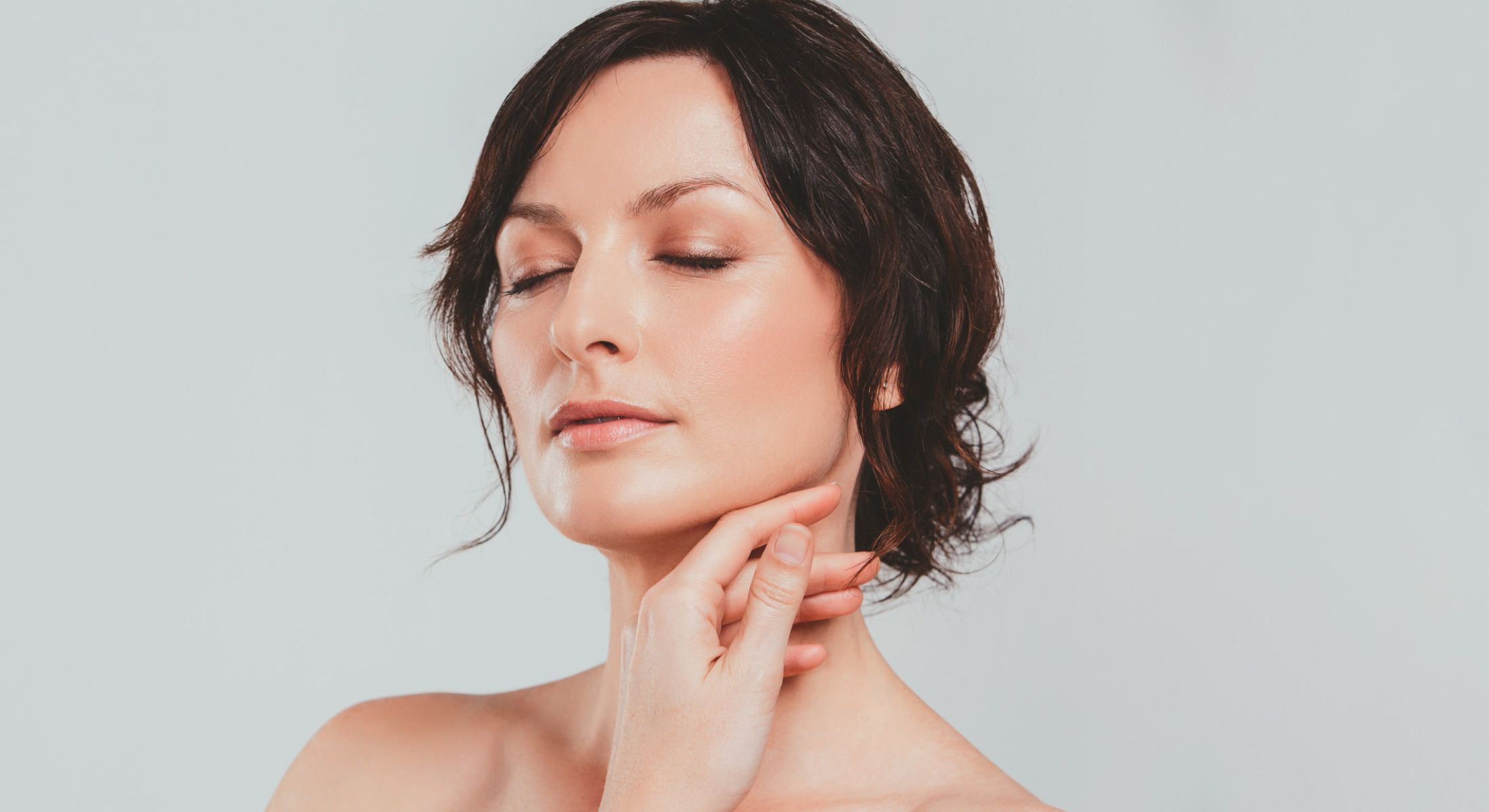 Woman with closed eyes and serene expression.