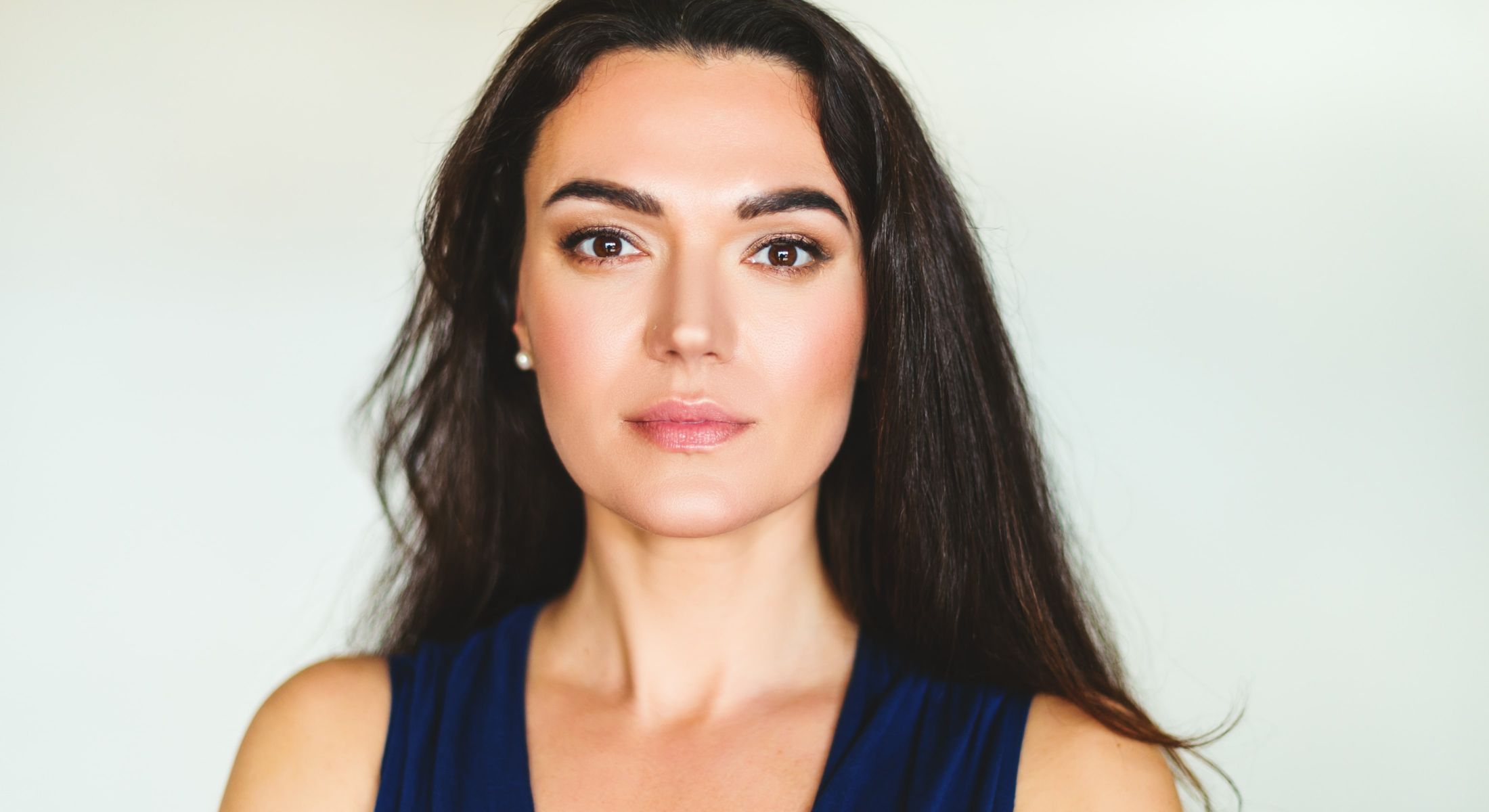 Portrait of a woman with long dark hair.