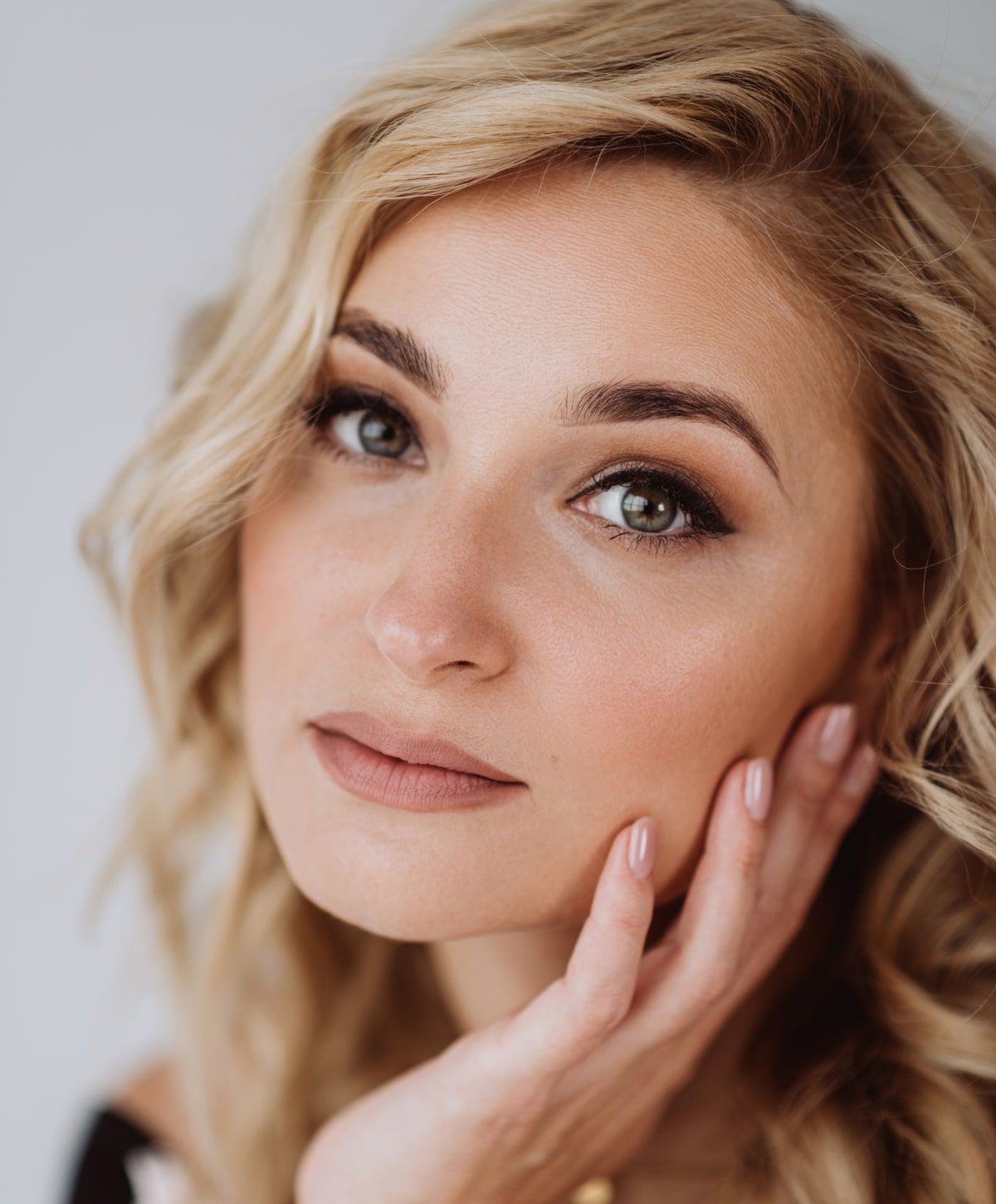 Close-up of a thoughtful woman with beautiful features.